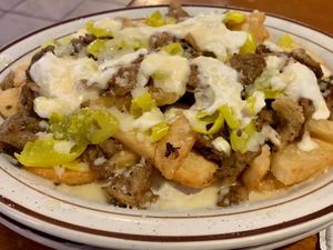 Load fries with seitan and vegan mozz  at Speedway Cafe in Dover