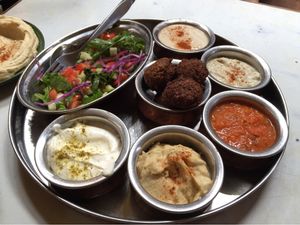 Mezze platter: Greek salad, hummus, falafel, tzatziki, banaganoush, roasted red pepper dip; served with warm pita at OR2K in Kathmandu