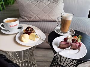 Vegan Cheesecake and Cherry Chocolate Cake w Oatmilk Latte at Portowa28 in Kolobrzeg