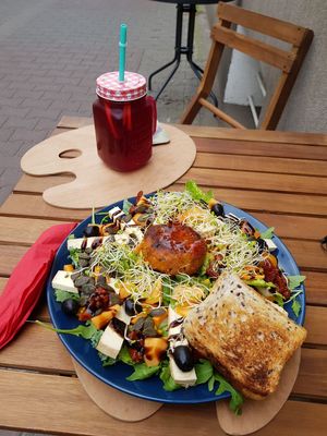 Salad of the day and iced fruit tea. at Kóltura in Poznan