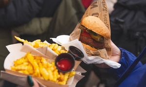 Seitan Burger and French fries with indian spices at Vegstop in Riga