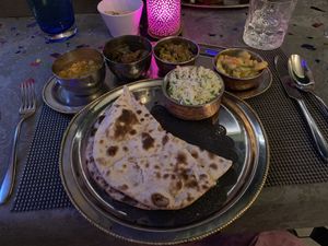Picture shows a vegan Thali. Indian dish where you get 4 different curries, rice and naan bread. Only available upon request. Ask server for vegan option. at Tamarind Hill in Zurich