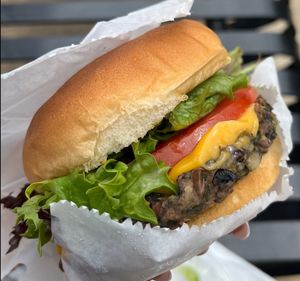 Our Gourmet Veggie Burger made with Mushrooms, Lentils, Spinach, Wild Rice & Beets.  at Zizi's Vegan Food Truck in Charlotte