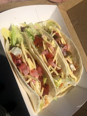 vegetable tacos with spiced pumpkin, beans, salad, jalapenos, tomatoes, delicious sauce, and vegan cheese upon request at no additional charge at Taco Boy in Noosa Heads
