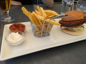 Vegan burger (with vegan cheese), chips and dips at Pappa Blå in Borgholm