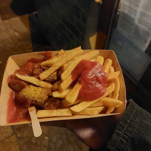 Vegan currywurst and pommes frites, with ketchup at Curry 61 in Berlin