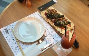Red juice & Pizza  at Nomad Urban Eatery in Seef