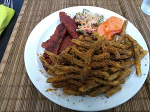 BBQ "ribs", seasoned fries, kale coleslaw (very tasty), papaya. at Earth's Kitchen  in Birmingham