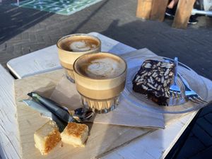 Coffee with oatmilk & vegan cake  at Grenswerk in Venlo