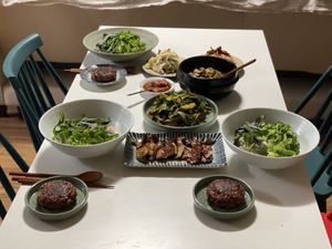 With guests, Korean dinner. Bibimbap with Denjangjjigae, Acorn muchim, Grilled Oyster mushroom, 2 types of Kimchi  at Helen's House in Seoul