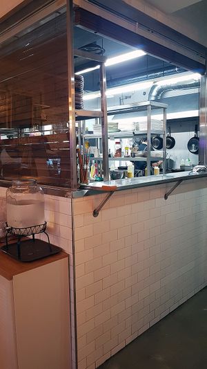 Interior of location, view towards the kitchen at Plant Cafe & Kitchen - Itaewon in Seoul