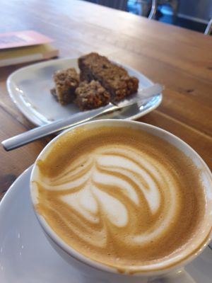 Oat milk cappuccino and delicious vegan cake at Rialto in Eyemouth