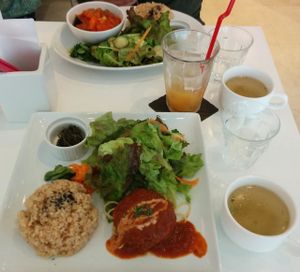 Their popular veggie burger plate & the daily lunch special in the background.  at Hanada Rosso in Tokyo
