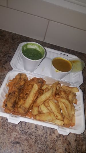 vegan battered sausage, chips, curry sauce and mushy peas ❤ at Minchella's in Sunderland