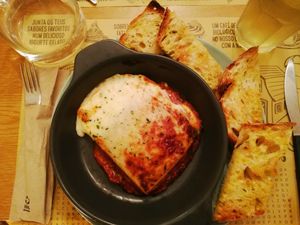 Vegan lasagne and garlic bread!  at Celeiro Cafe in Peniche