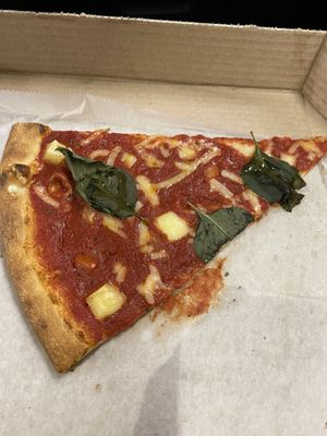 Slice of Vegan Margarita Pizza.  at Artistic Pizza in New York City