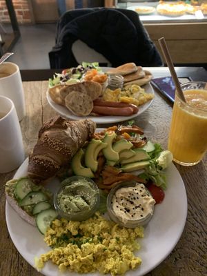 Vegan breakfast with additional avocado, fresh juice, cappuccino with oat milk at Fitagain in Krakow