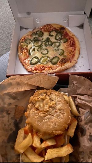 Vegan mountain burger and pizza with vegan cheese at The Hippy Chippy in Paisley