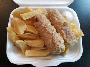 Linda mac battered sausages, chips and a big pickle - yum! at The Hippy Chippy in Paisley