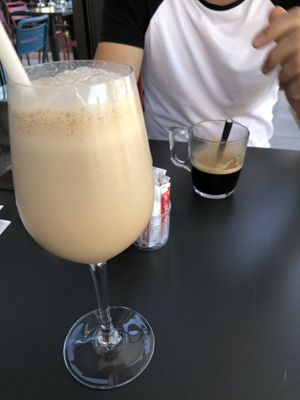 Frappé with oat milk (5€) and americano (2,20€)  at Version Originale in Porto-vecchio