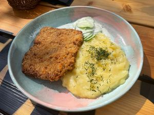 Polish schabowy with mashed potatoes and mizeria salad at Bracka 20 in Warsaw