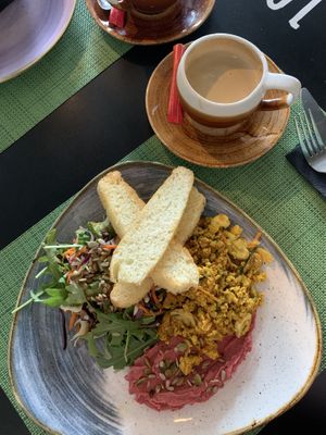 Scramble tofu, focaccia and beetroot hummus, fresh salad.  at Urban & Veggie in Dubrovnik