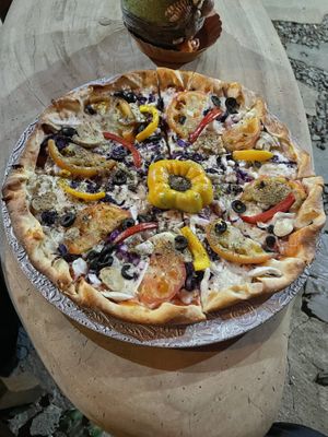 Vegetarian pizza with cheese and vegetables   at Pizza Yolo in Santa Catalina