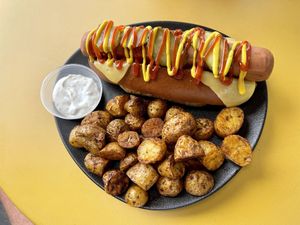 Hot dog with cheese and oven baked potatoes.   at Not Dog in Nice