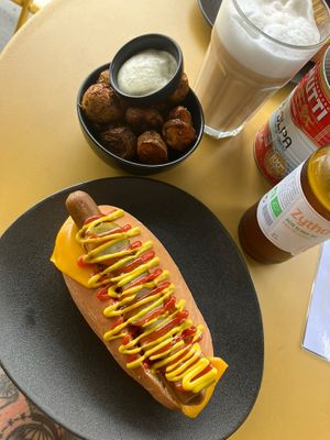 Original hot dog with added cheese and side of potatoes  at Not Dog in Nice