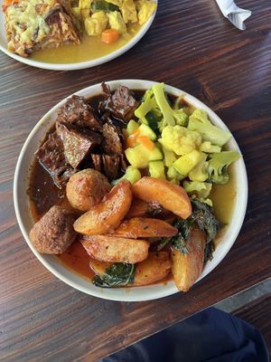 Verduras + seitan + papas  at Holy Bao in Santiago
