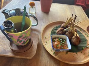 Lao green tea and fried vegetables with lemongrass   at Bouang  in Luang Prabang