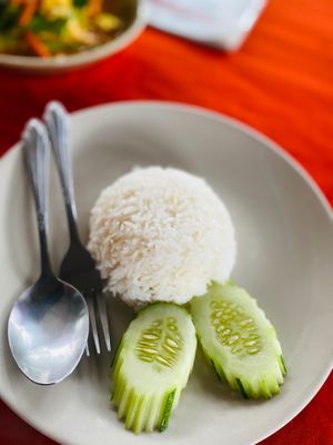 Rice and cucumber at P & T Hostel in Koh Samui