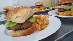 Homemade bean burgers and chips at Casa Arts in Malaga