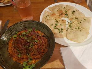 Tomato risotto and garlic and herb flatbread at Encore  in Chorley