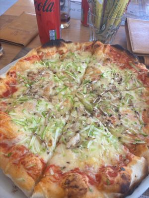 Amazing vegan pizza with vegan cheese, zucchini and mushrooms  at Lupo D'Argento in Zabljak