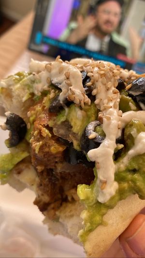 este completo tiene seitán, champis, “carne” de soya, queso veg, tomate, palta, doble porción de aceitunas, mayo veg y sésamo   at El Completo Feliz in Recoleta