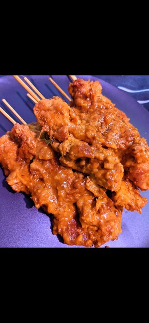 Chicken satay sticks at Vincent's Marketplace in Fitzroy
