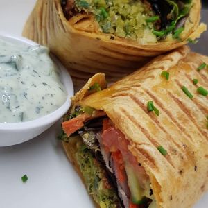 Woods own falafel, hummus and salad wrap with a soya yoghurt, mint & cucumber dip. at Woods in Totnes