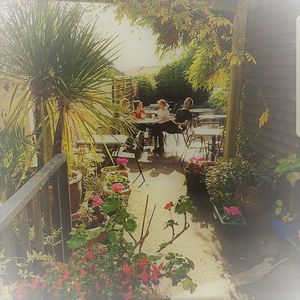 Our beautiful secluded & quiet garden at the back of the cafe at Woods in Totnes