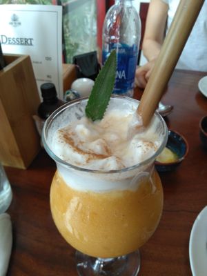 Vegan smoothie made from pineapple, mango and another fruit that I didn't remember. Topped with vegan coconut cream at Hanoi Taco Bar in Hanoi