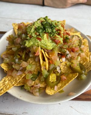 Nachos with guacamole, pico de gallo and jalapeños  at Surf House in Barcelona