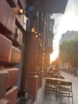Tables in front of the store at Umamitu by Papuvege in Lodz