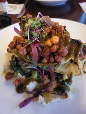 Melted Cabbage $26
Roasted miso cabbage wedge, butter bean pureé, spiced crispy chickpeas, wilted mustard greens, salsa verde at Mews in Provincetown