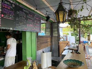 Menu and tables at Floresta Cafe in Delray Beach