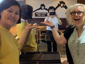 The owners loving the sticker I gave them at Muku Taiwanese Vegetarian Food in Kyoto