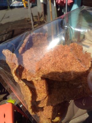 Finished spicy cracker product...their "store" usually offers an assortment of snacks and instant vegan noodles, varying greatly by season at Maesai Health in Mae Sai