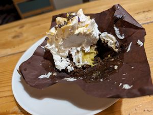 Messy photo but to show you that the insides of this incredible brownie had cream, with delectable panna. at Leccornie in Milan