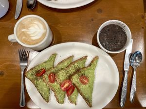 Avocado toast with a side of black beans and oat milk latte   at Aunt Chubby's in Hopewell