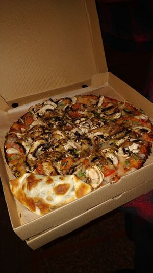 Vegan pizza and empanada 🥰 at Yerbamate in Conil De La Frontera