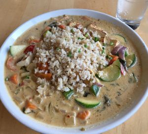 Green Curry (vegan as is). Good to the last drop. Broccoli, zucchini, red peppers, onions & carrots in a coconut broth (I added tofu). at Peoples Organic in Eden Prairie
